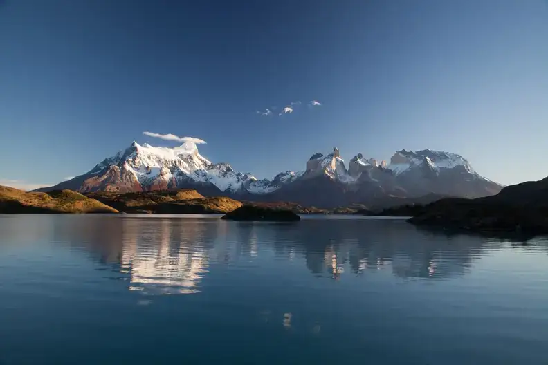 A reflection of a snow-covered mountain
